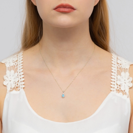 Przejdź do produktu Zawieszka z białego złota 585 z topazem i diamentami 0,095ct The Diamonds