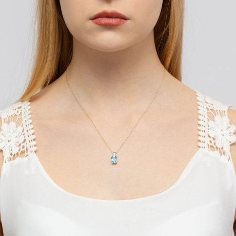 Przejdź do produktu Zawieszka z białego złota 585 z topazem i diamentem 0,005ct The Diamonds