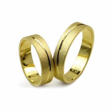 Przejdź do produktu Obrączki ślubne z żółtego złota płaskie 5mm fala Special S068